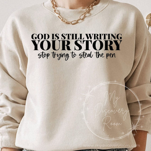 God Is Still Writing Your Story Stop Trying To Steal The Pen Graphic Tee