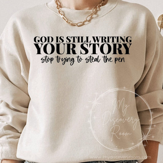 God Is Still Writing Your Story Stop Trying To Steal The Pen Graphic Tee - MyDiscoveryRoom