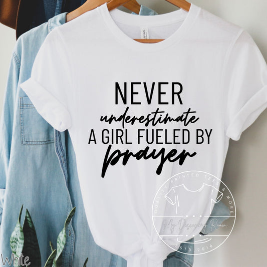 Never Underestimate A Girl Fueled By Prayer Graphic Tee - MyDiscoveryRoom