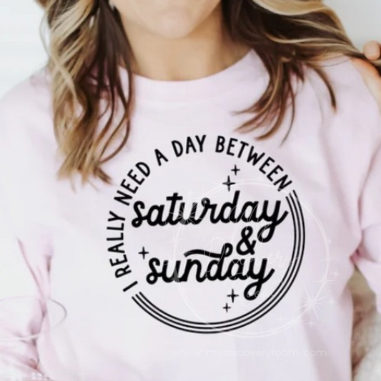 I Really Need A Day Between Saturday & Sunday Graphic Tee