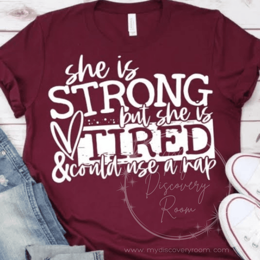 She Is Strong But She Is Tired Graphic Tee - MyDiscoveryRoom